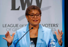 Shock Upset Brewing In Los Angeles? A female politician speaking passionately at a podium during a conference