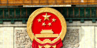 National emblem of China displayed on a government building