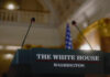Explosive Drone Plot Targeted White House Press podium with microphones and an American flag in the background