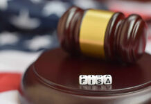 Judge’s gavel on a sound block with letter cubes spelling FISA