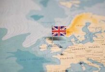 Snap Election Gambit—Genius Or Suicide? A map of Europe with a small flag of the United Kingdom pinned on it