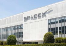 Wall Street Bet Mints First Trillionaire Exterior view of the SpaceX building with a prominent logo