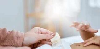 Caregiver changing a baby's diaper