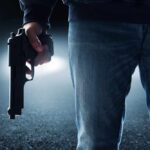 Memphis Prank Ends In Felony Charges A person holding a handgun in a dark environment