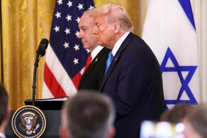 Washington,,Dc,,Usa,-,February,4,,2025:,President,Donald,J. Donald Trump and another official at a press conference with flags in the background