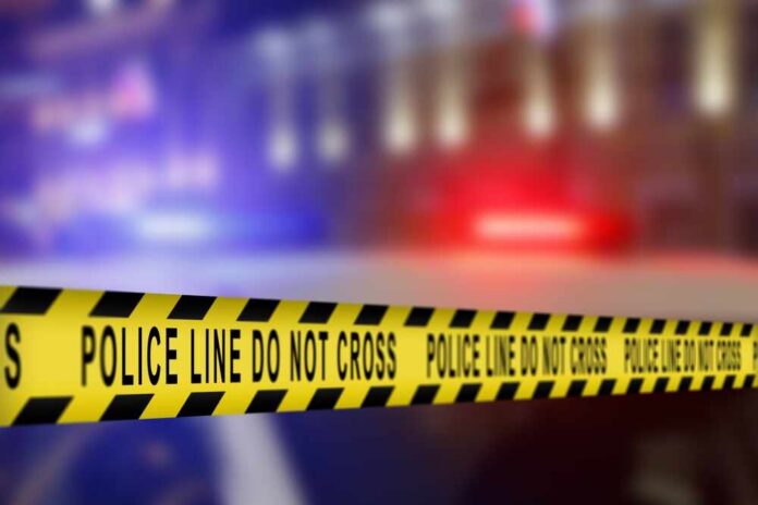 Yellow,Tape,Showing,Text,"police,Line,Do,Not,Cross",Restricting Yellow police tape reading 'DO NOT CROSS' at a crime scene