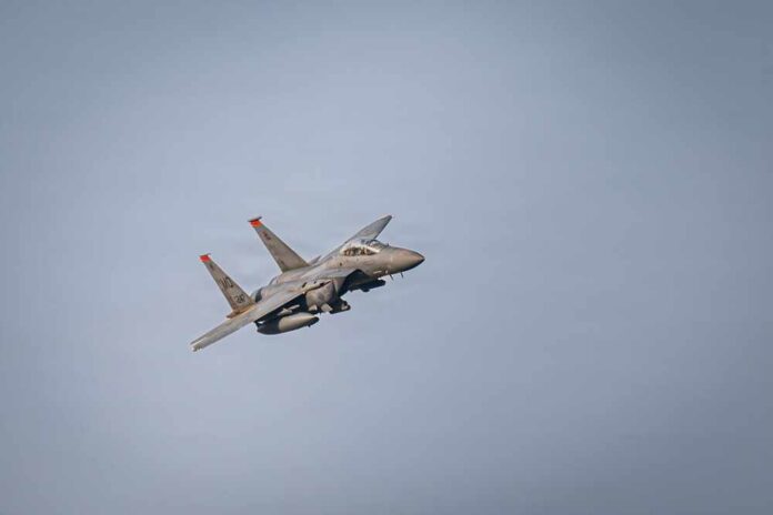 A,U.s.,Air,Force,F-15e,Strike,Eagle,Aircraft,Flies,In A military fighter jet flying against a clear sky