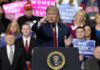 Trade Victory Claim Sparks Michigan Uproar politician speaking at a rally podium