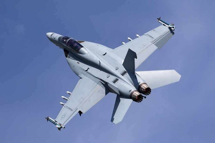 Fighter jet banking in clear sky