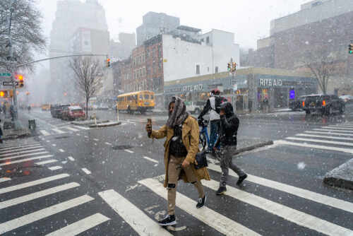 New,York,Ny/usa-january,30,,2019,Pedestrians,In,The,Chelsea,Neighborhood People crossing a snowy street in an urban area during a winter storm