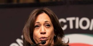 woman speaking at a podium with microphone