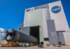 Design Blunder Almost Killed America’s Station Rocket stage moved on transporter outside large NASA assembly building