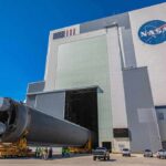 Design Blunder Almost Killed America’s Station Rocket stage moved on transporter outside large NASA assembly building