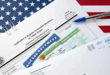 immigration forms with green card and social security card on US flag background