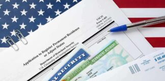immigration forms with green card and social security card on US flag background