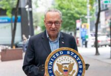Genocide Claim Hijacks Schumer’s Big Reveal man speaking at a podium with a United States Senate seal