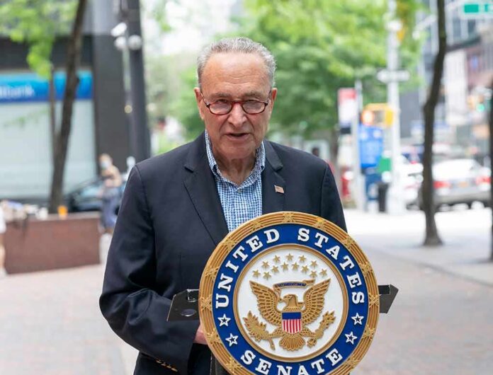 shutterstock_1765616111 man speaking at a podium with a United States Senate seal