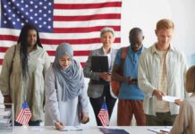 Voters standing in line at a polling station