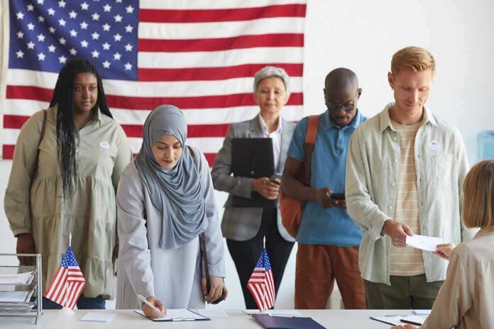 shutterstock_1810358971 Voters standing in line at a polling station