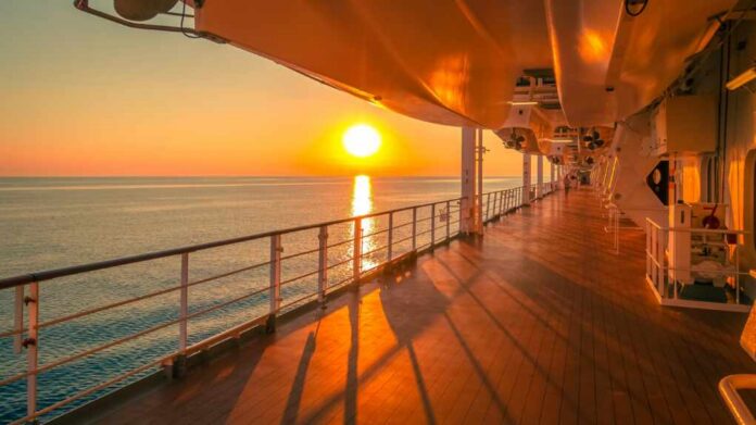 Sunset,Cruise,Ship,Promenade,Deck. Sunset view from a cruise ship deck overlooking the ocean