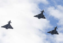 Saudi Airspace Clash Claims Escalate Three fighter jets flying in formation against a cloudy sky