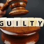 Judge's gavel above blocks spelling guilty