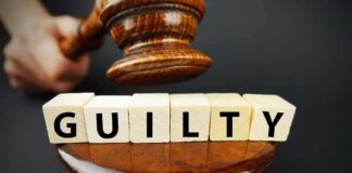 Judge's gavel above blocks spelling guilty