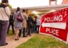 People lining up outside a polling place