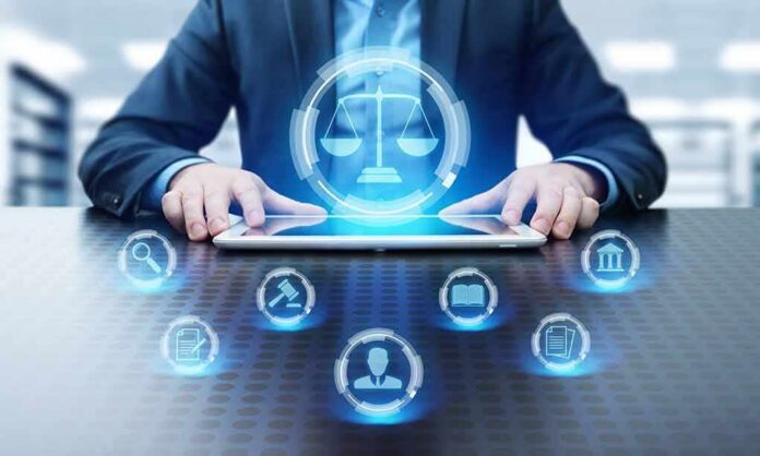 shutterstock_1079923613 Businessperson using tablet with digital justice icons