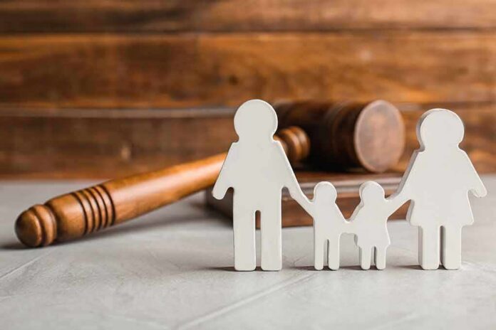 Paper cutout family with gavel in background