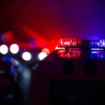 Police car light bar flashing red and blue at night