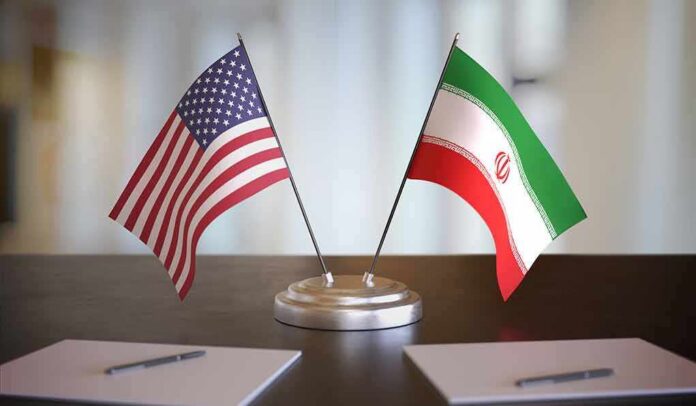 United States and Iran desk flags on a stand
