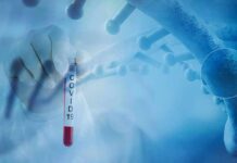 Gloved hand holding a COVID-19 test tube beside a stylized DNA helix