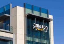 Sky Takeover: Amazon Plots 500-City Push amazon logo on modern glass office building
