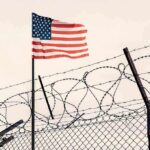 Mystery Stealth Aircraft Sparks New Speculation American flag above barbed wire fence