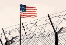 Mystery Stealth Aircraft Sparks New Speculation American flag above barbed wire fence