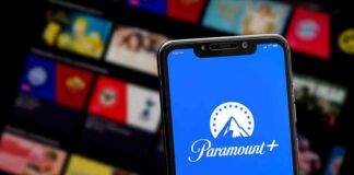 Smartphone showing Paramount+ app on blue screen