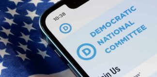 Smartphone showing a political committee webpage on an American flag
