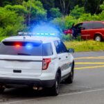Mysterious Big Cats Baffle Indiana Police SUV with flashing lights at roadside crash scene