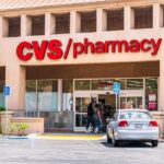 Exterior view of a CVS pharmacy with customers entering