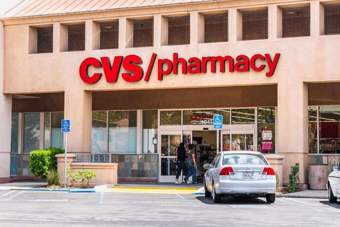 shutterstock_1471184933 Exterior view of a CVS pharmacy with customers entering