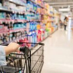 Trade Payback: Canada Gets Locked Out Shopper pushing a cart down a supermarket aisle