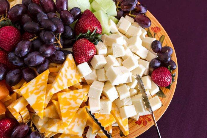 Party,Hors,D'oeuvre,Platter,Of,Assorted,Cheeses,And,Fruits,From A colorful cheese and fruit platter featuring various cheeses and fresh fruits