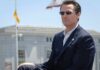 man in suit wearing sunglasses outdoors