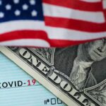 COVID Cash Scammers Exposed American flag over a dollar bill and a COVID-19 relief check