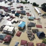 Monster Typhoon Batters Japan Aerial view of flooded residential neighborhood