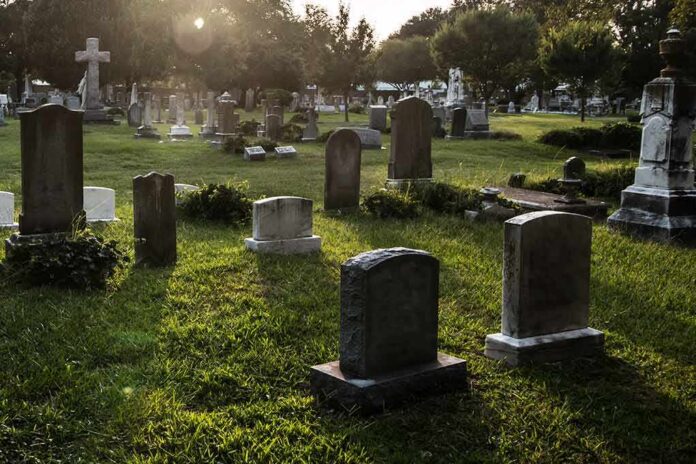 Gravestones in a sunlit cemetery