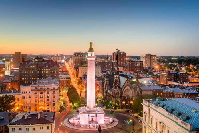 Washington Monument in a city square at dusk