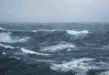 SoCal Surf Warning From Distant Beast Rough ocean waves under a cloudy sky