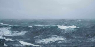 Rough ocean waves under a cloudy sky